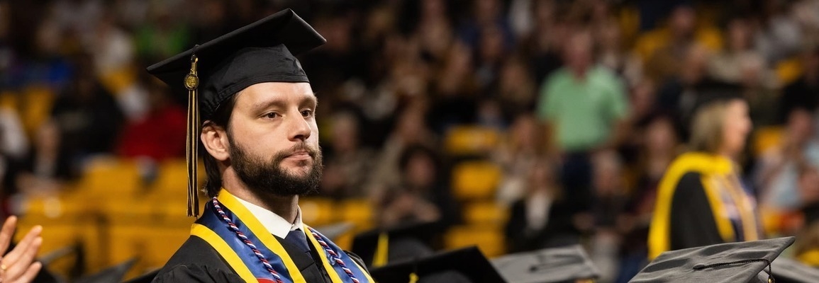 ASU Student Veteran standing during military recognition at Commencement