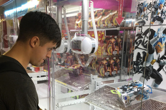Nick Morgan playing a claw machine during a trip to Japan.